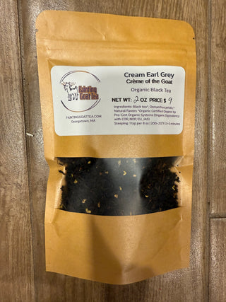 2 oz of organic cream earl grey loose black tea in eco-friendly packaging with fainting goat tea logo showing the color of the tea and full ingredients list